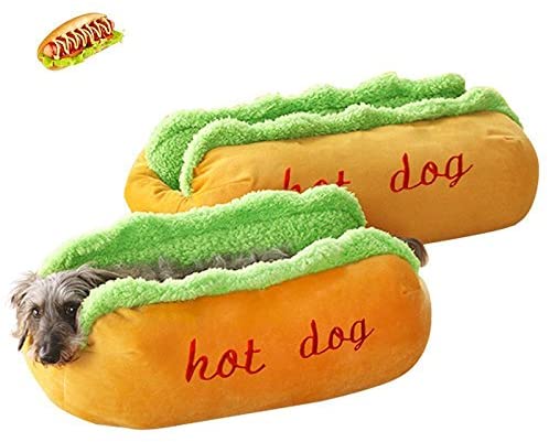 Small grey dog lying in the hot dog shaped plush pet bed, empty bed behind