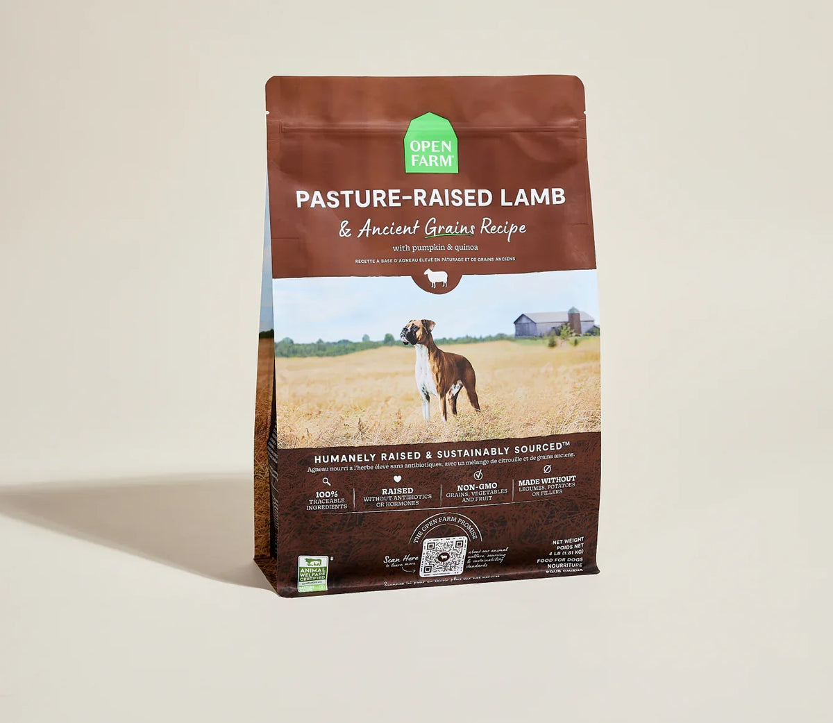 Open Farm pasture-raised lamb & ancient grains dry dog food bag with a boxer dog in a golden field